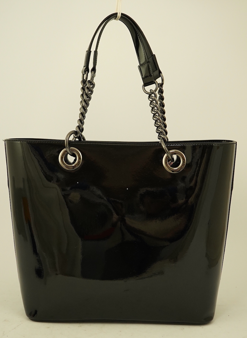 A DKNY black patient leather tote with scarf detail.